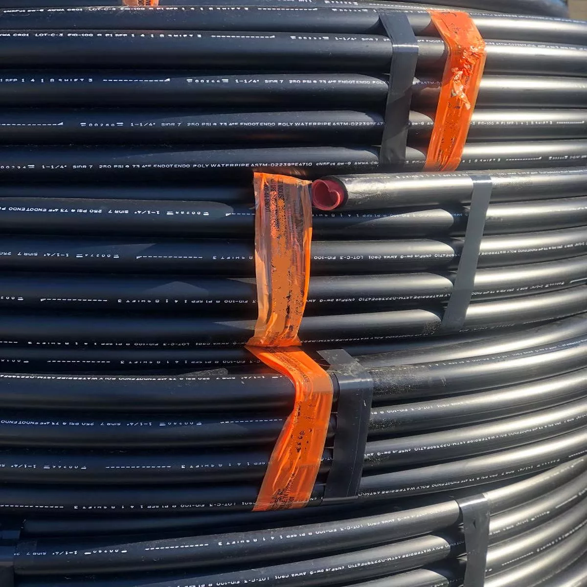 1.5" X 100' X 125/100# BLACK POLY PIPE - 28" COIL
